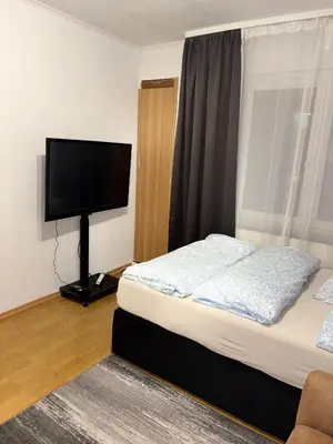 Ein Bett oder Betten in einem Zimmer der Unterkunft Komfortwohnung mit zwei Schlafzimmern in Barmen