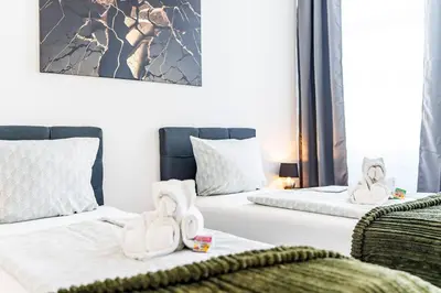 Ein Bett oder Betten in einem Zimmer der Unterkunft Modernes Apartment für 5 Personen mit Privatüarkplatz - Wlan und Kaffeevollautomat