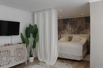 Ein Bett oder Betten in einem Zimmer der Unterkunft Kernsanierte moderne helle Wohlfühloase