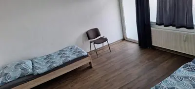 Ein Bett oder Betten in einem Zimmer der Unterkunft Ganze Wohnung in Wülfrath mit Balkon 4 Gäste