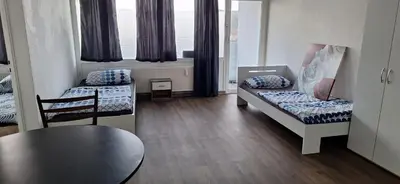 Ein Bett oder Betten in einem Zimmer der Unterkunft Ganze Wohnung in Wülfrath mit Balkon 4 Gäste