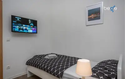 Ein Bett oder Betten in einem Zimmer der Unterkunft BEGE APARTMENTS ComfortStay