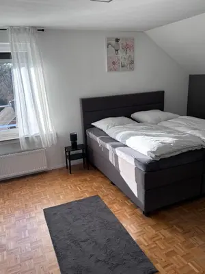 Ein Bett oder Betten in einem Zimmer der Unterkunft Juwel im POTT-Zentral-100 qm-Stellplatz-Balkon-Kamin