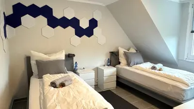 Ein Bett oder Betten in einem Zimmer der Unterkunft DUTTI'S HOME - Apartment B I 2 Rooms I 4 Beds I Kitchen I WiFi I TV I Parking I Autobahn