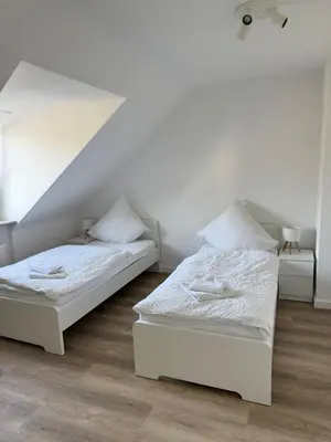 Ein Bett oder Betten in einem Zimmer der Unterkunft Two-Bedroom Apartment