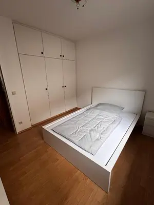 Ein Bett oder Betten in einem Zimmer der Unterkunft Große Wohnung verkehrsgünstig im Zentrum Duisburgs