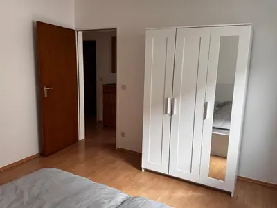 Ein Bett oder Betten in einem Zimmer der Unterkunft Große Wohnung verkehrsgünstig im Zentrum Duisburgs