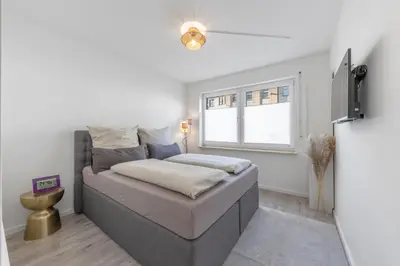Ein Bett oder Betten in einem Zimmer der Unterkunft Aurion City - Design Apartment in Düsseldorf