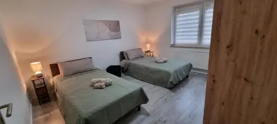 Ein Bett oder Betten in einem Zimmer der Unterkunft EG-Wohnung in direkter Nähe des SG HBF