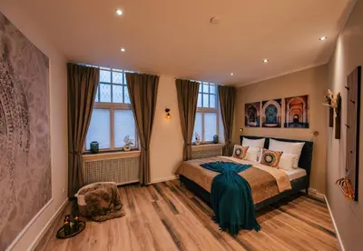 Ein Bett oder Betten in einem Zimmer der Unterkunft Deluxe Suite Hafennah