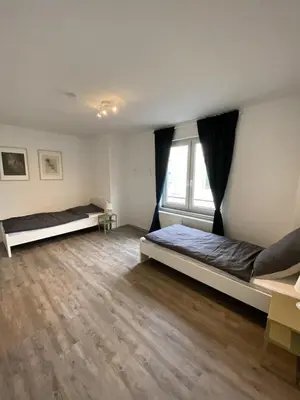 Ein Bett oder Betten in einem Zimmer der Unterkunft SAP18 fitter's apartment in Erkrath