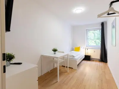 Ein Bett oder Betten in einem Zimmer der Unterkunft BudgetRoom 3 Bedroom Perfect for Teams