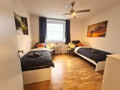 Ein Bett oder Betten in einem Zimmer der Unterkunft Moderne Wohnung mit Balkon und top Anbindung