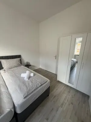 Ein Bett oder Betten in einem Zimmer der Unterkunft Ferienwohnung Essen Frohnhausen 2