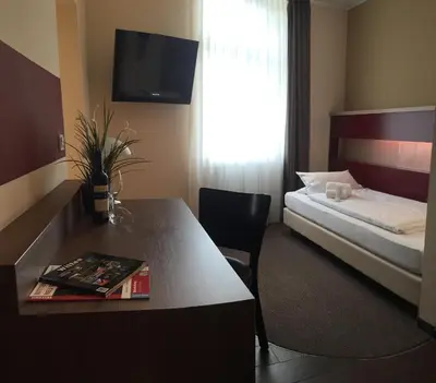 Ein Bett oder Betten in einem Zimmer der Unterkunft Hotel Hoppe