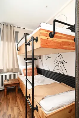 Ein Bett oder Betten in einem Zimmer der Unterkunft Self check in City Hostel Nordstern