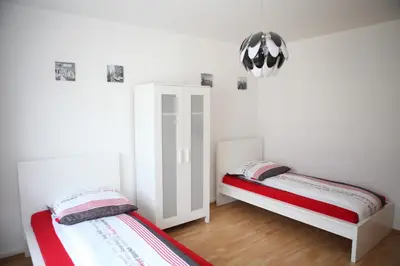 Ein Bett oder Betten in einem Zimmer der Unterkunft White House Bochum II
