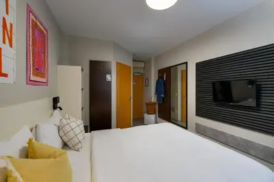 Ein Bett oder Betten in einem Zimmer der Unterkunft SleepinRoomz Boutique Hotel Dortmund-West