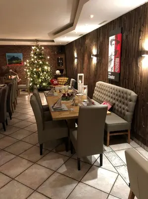 Ein Sitzbereich in der Unterkunft Das kleine Landhotel