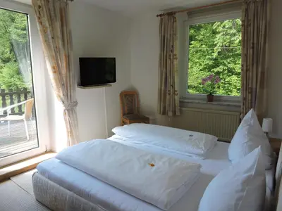 Ein Bett oder Betten in einem Zimmer der Unterkunft Hotel Bergische Schweiz