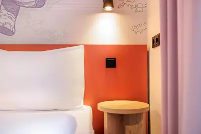 Ein Bett oder Betten in einem Zimmer der Unterkunft McDreams Hotel Wuppertal City