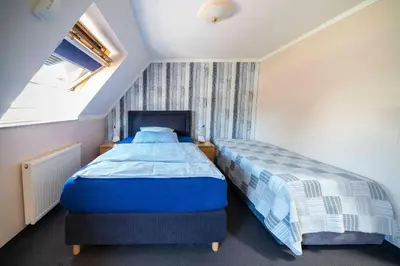 Ein Bett oder Betten in einem Zimmer der Unterkunft City Hotel Hilden