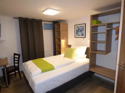 Ein Bett oder Betten in einem Zimmer der Unterkunft Hotel Art Inn Dinslaken