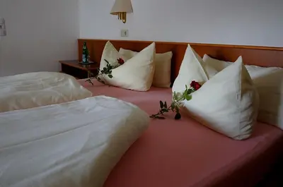 Ein Bett oder Betten in einem Zimmer der Unterkunft Elektro-Hotel Rosenhaus GmbH