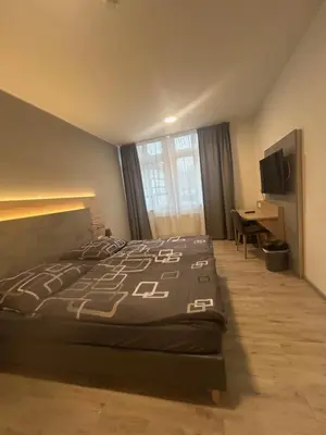 Ein Bett oder Betten in einem Zimmer der Unterkunft Burbaums Restaurant Hotel