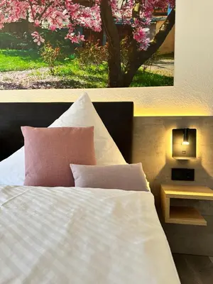 Ein Bett oder Betten in einem Zimmer der Unterkunft an Hotel GmbH