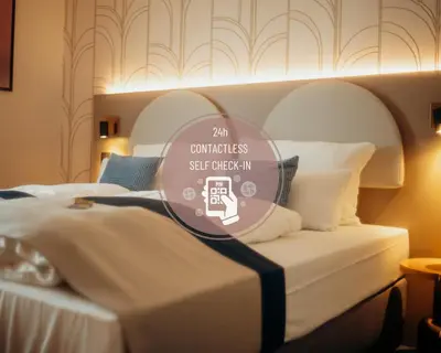 Ein Bett oder Betten in einem Zimmer der Unterkunft guestified LIYANA Hotel