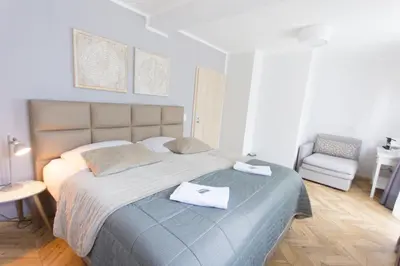 Ein Bett oder Betten in einem Zimmer der Unterkunft TM Suites