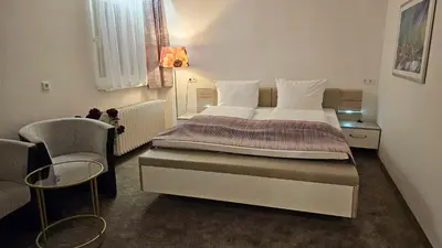 Ein Bett oder Betten in einem Zimmer der Unterkunft Hotel Kölner Hof