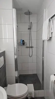 Ein Badezimmer in der Unterkunft Hotel Kölner Hof