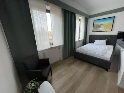 Ein Bett oder Betten in einem Zimmer der Unterkunft Hotel Wolfsjäger
