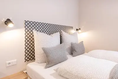 Ein Bett oder Betten in einem Zimmer der Unterkunft The Woodmans Airport Boardinghouse