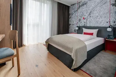 Ein Bett oder Betten in einem Zimmer der Unterkunft IntercityHotel Duisburg