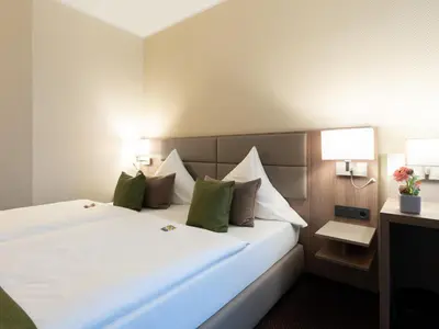Ein Bett oder Betten in einem Zimmer der Unterkunft Hotel im Park