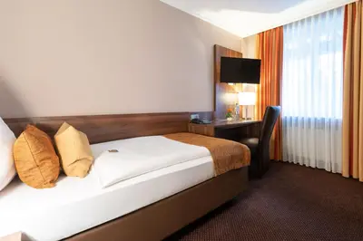 Ein Bett oder Betten in einem Zimmer der Unterkunft Hotel im Park