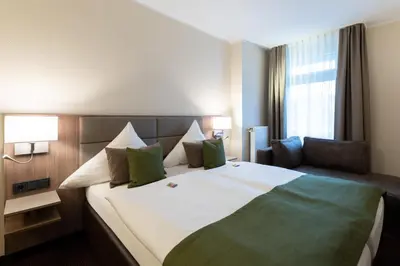 Ein Bett oder Betten in einem Zimmer der Unterkunft Hotel im Park