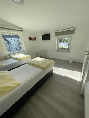 Ein Bett oder Betten in einem Zimmer der Unterkunft Apartment Dusseldorf-City
