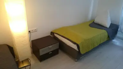 Ein Bett oder Betten in einem Zimmer der Unterkunft AVI City Apartments GoodHouse
