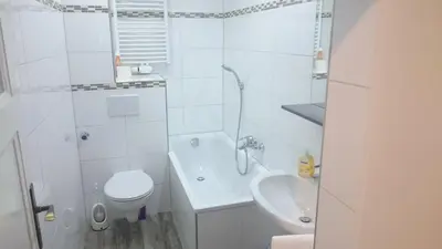 Ein Badezimmer in der Unterkunft AVI City Apartments GoodHouse