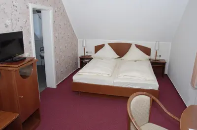 Ein Bett oder Betten in einem Zimmer der Unterkunft Hotel Eichenhof