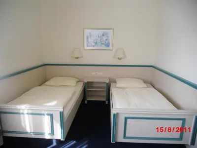 Ein Bett oder Betten in einem Zimmer der Unterkunft Centralhotel Ratingen