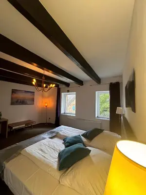 Ein Bett oder Betten in einem Zimmer der Unterkunft Hotel Biedermeier