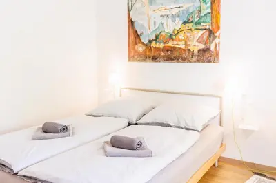 Ein Bett oder Betten in einem Zimmer der Unterkunft Glück Auf Appartements Rüttenscheiderstraße Essen