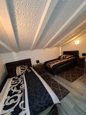 Ein Bett oder Betten in einem Zimmer der Unterkunft Die Hotelalternative
