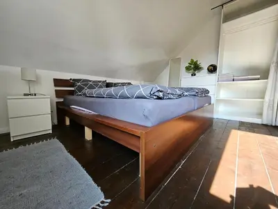Ein Bett oder Betten in einem Zimmer der Unterkunft Ferienwohnung Oberhausen Alstaden