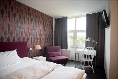 Ein Bett oder Betten in einem Zimmer der Unterkunft Wald & Golfhotel Lottental